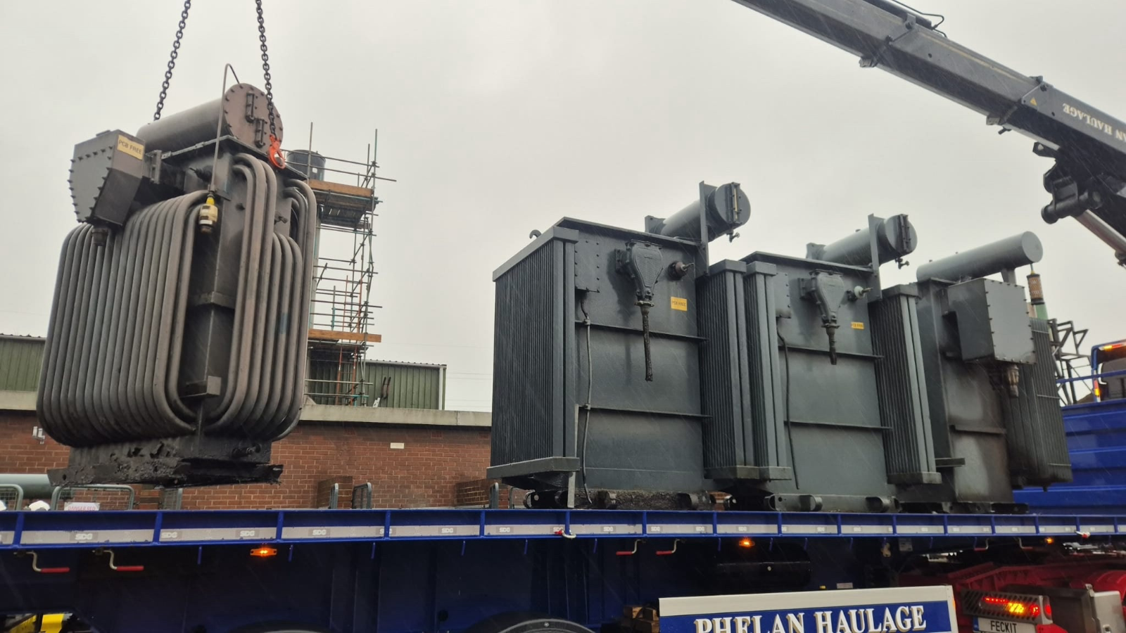 OSS craning PCB-free transformers onto a haulage trailer