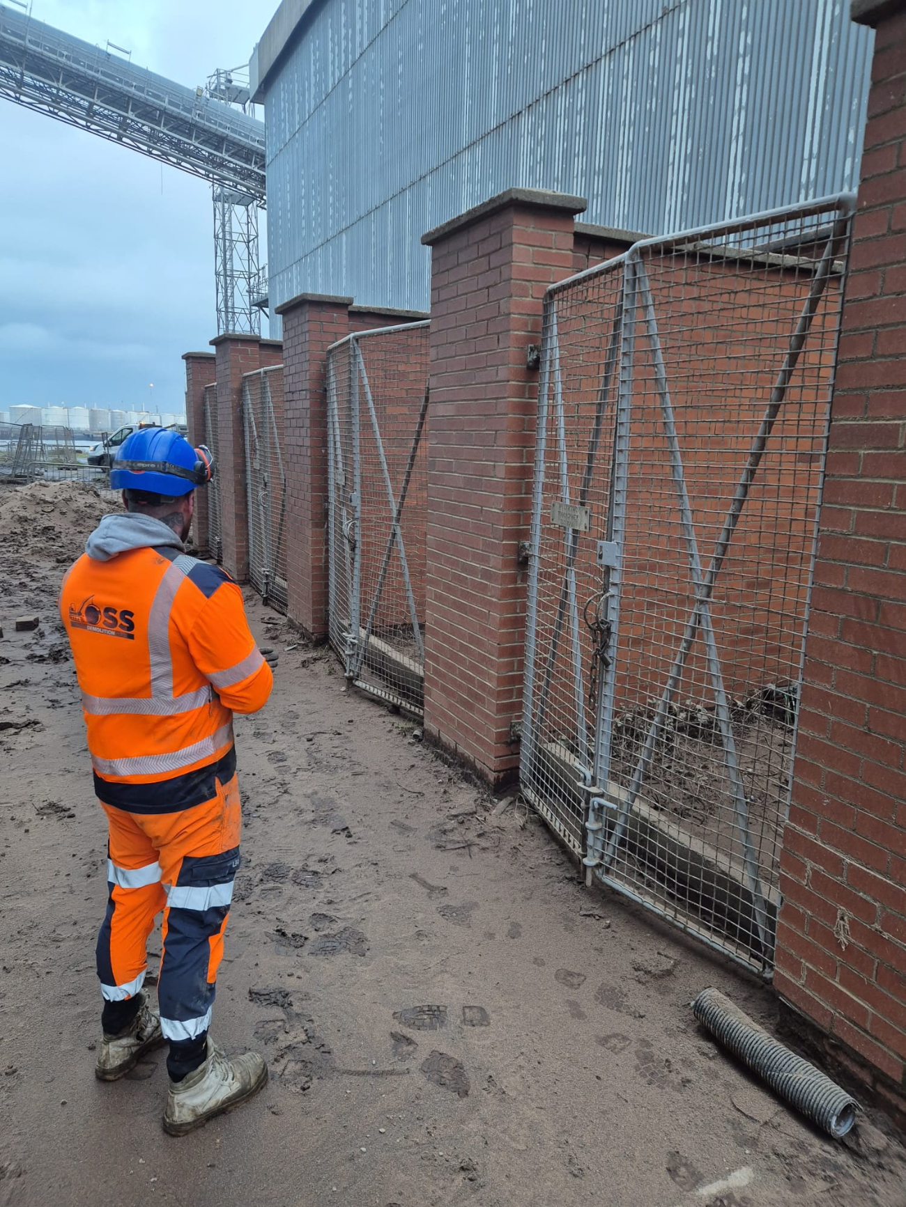 OSS operative at brick-built substation enclosures